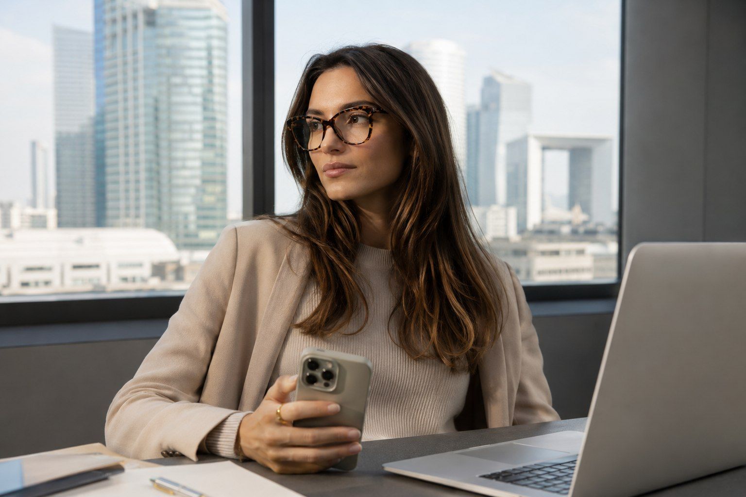 Professional woman wearing Eyegis glasses while reviewing documents